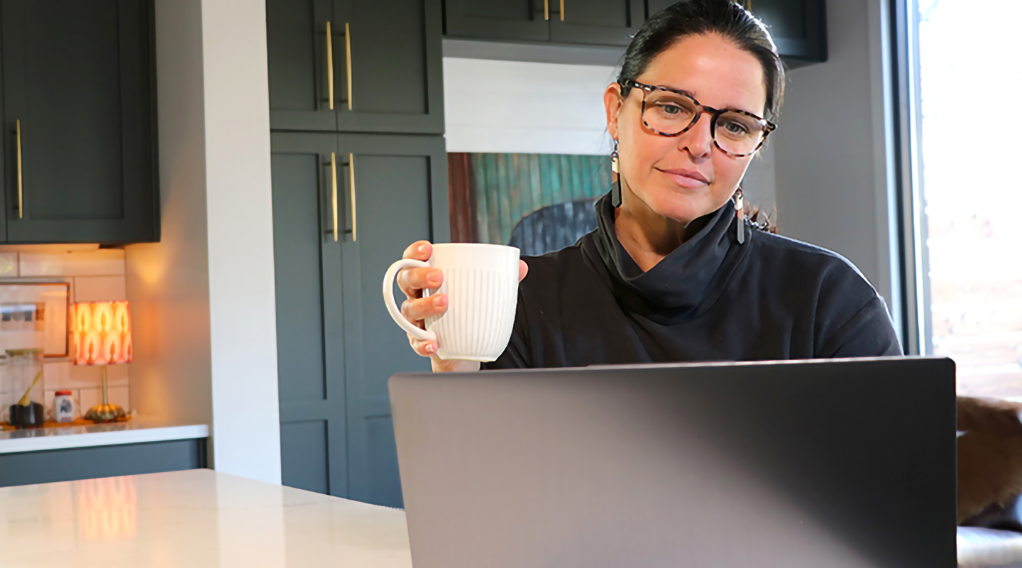 Woman working on computer at home