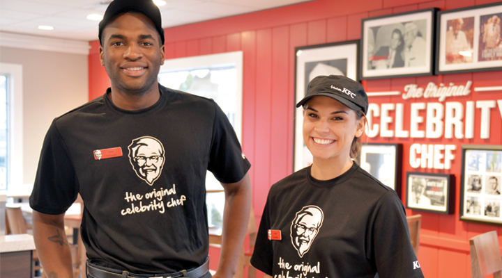 Photo of two Yum! team members in a restaurant
