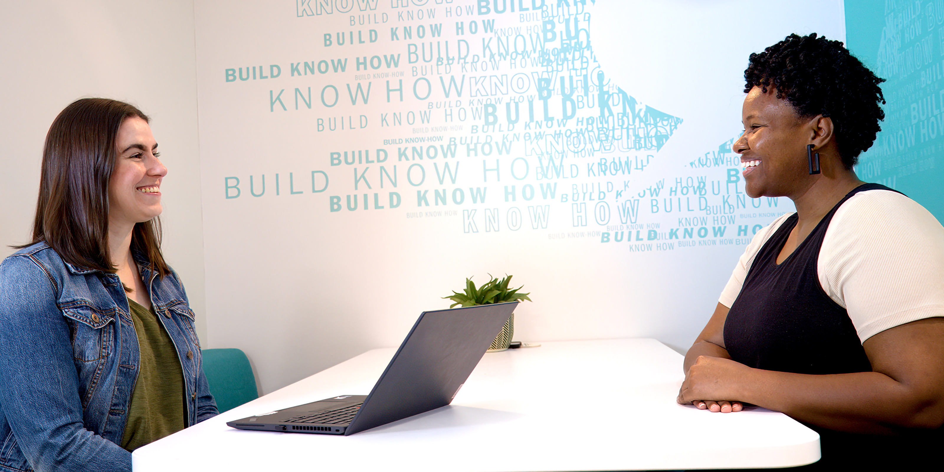 photo of two women associates collaborating