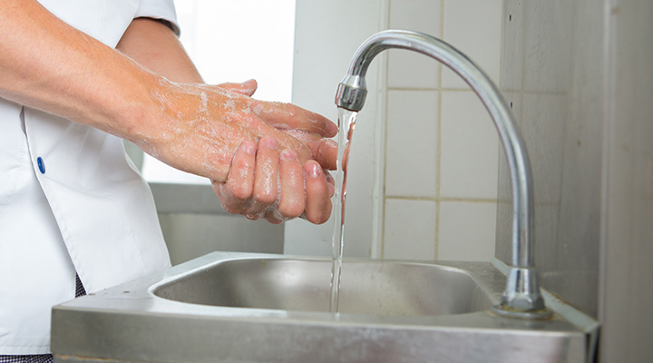 Photo of someone washing their hands