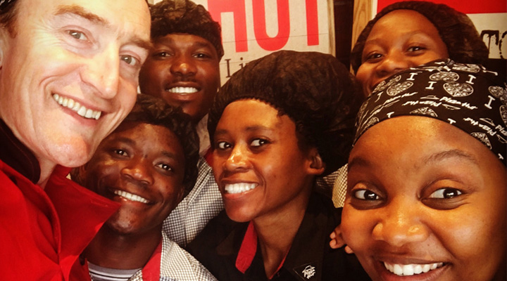 Close up photo of Yum! team members and manager